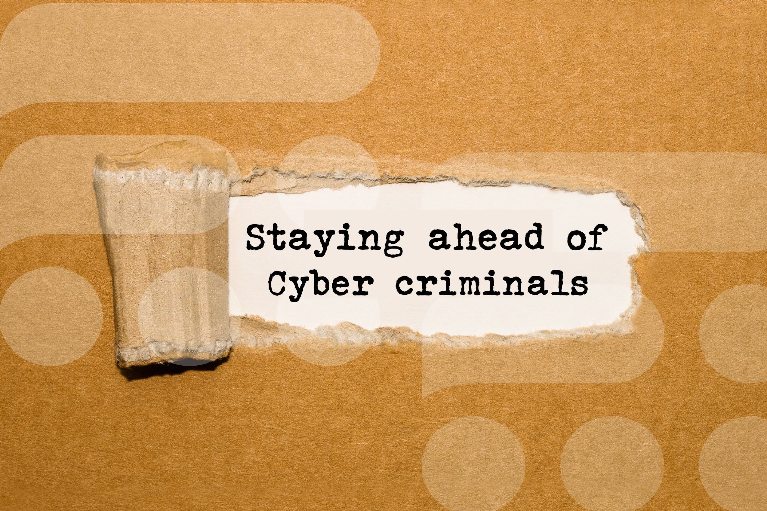 Staying ahead of Cyber criminals on brown cardboard